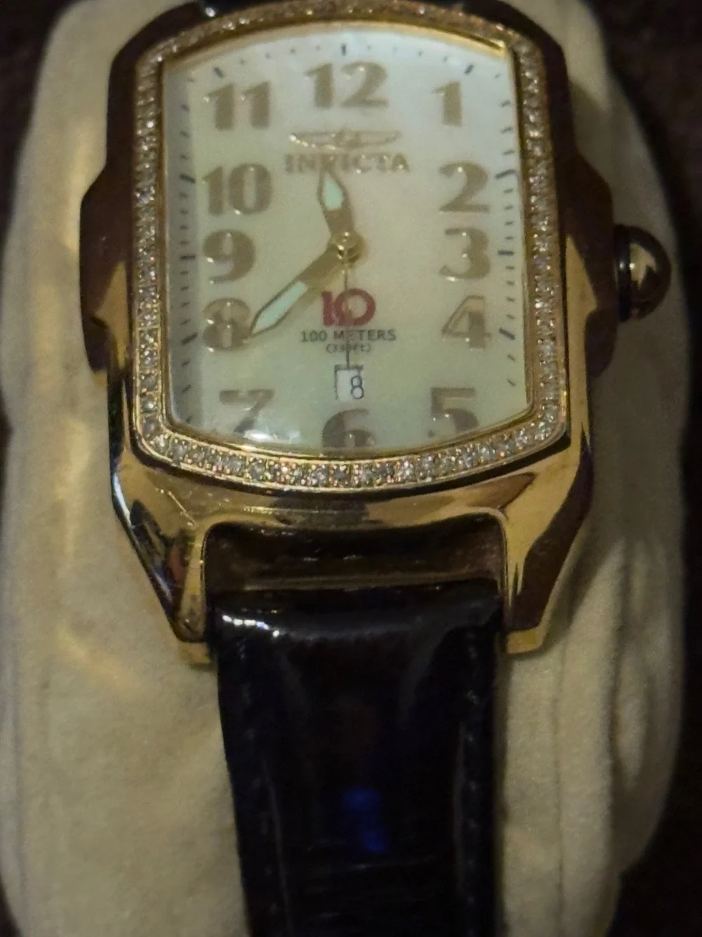 Invicta Women’s Gold-Tone Diamond Accent Watch with White Dial and Brown Strap.